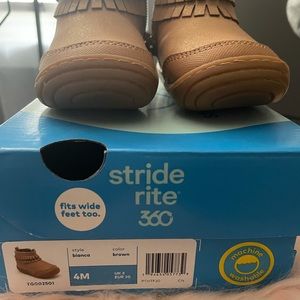 Brown with pink stitching baby boots. Zip up on the sides. Gently worn!